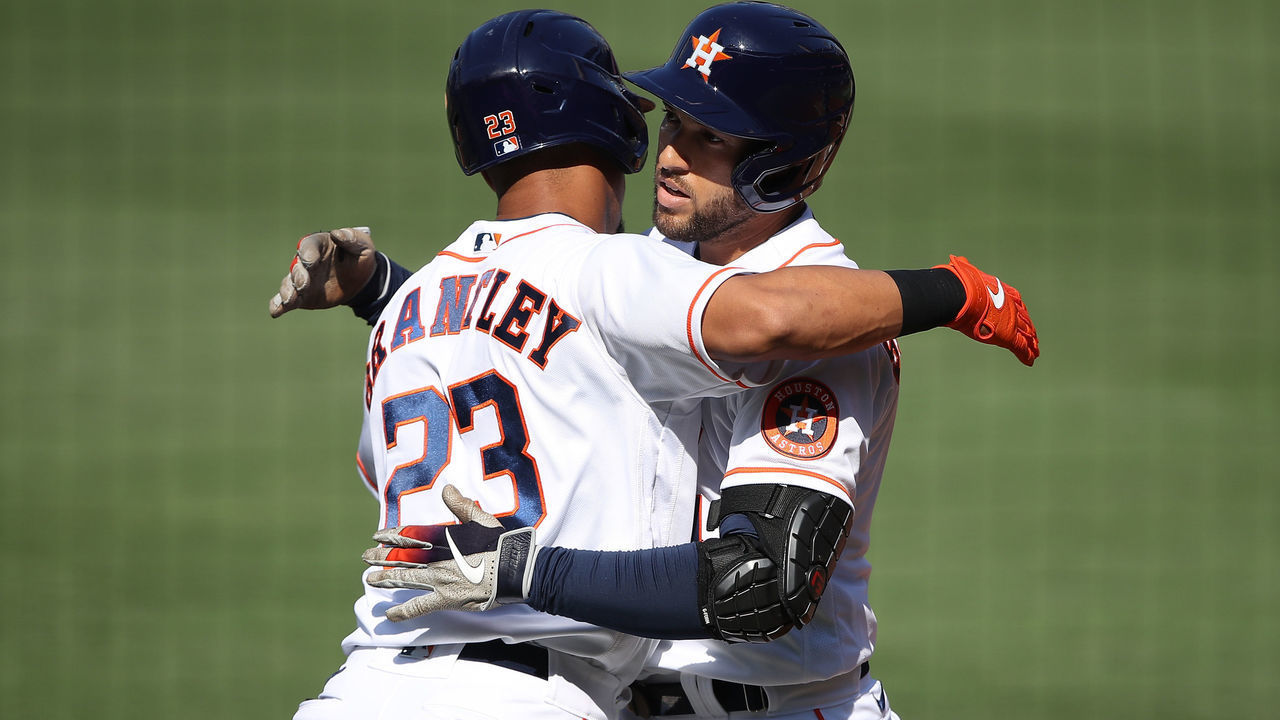 SAN DIEGO, CALIFORNIA - OCTOBER 15: George Springer #4 of the Houston Astros celebrates a solo home run hit against John Curtiss #84 of the Tampa Bay Rays with teammate Michael Brantley #23 during the first inning in Game Five of the American League Championship Series at PETCO Park on October 15, 2020 in San Diego, California.