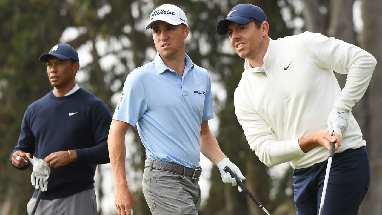 SAN FRANCISCO, CALIFORNIA - AUGUST 07: Rory McIlroy of Northern Ireland reacts to his shot from the 12th tee as Justin Thomas of the United States and Tiger Woods of the United States look on during the second round of the 2020 PGA Championship at TPC Harding Park on August 07, 2020 in San Francisco, California.