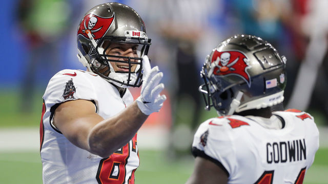 DETROIT, MICHIGAN - DECEMBER 26: Rob Gronkowski #87 of the Tampa Bay Buccaneers celebrates a 25 yard reception for a touchdown with Chris Godwin #14 during the third quarter of a game against the Detroit Lions at Ford Field on December 26, 2020 in Detroit, Michigan.
