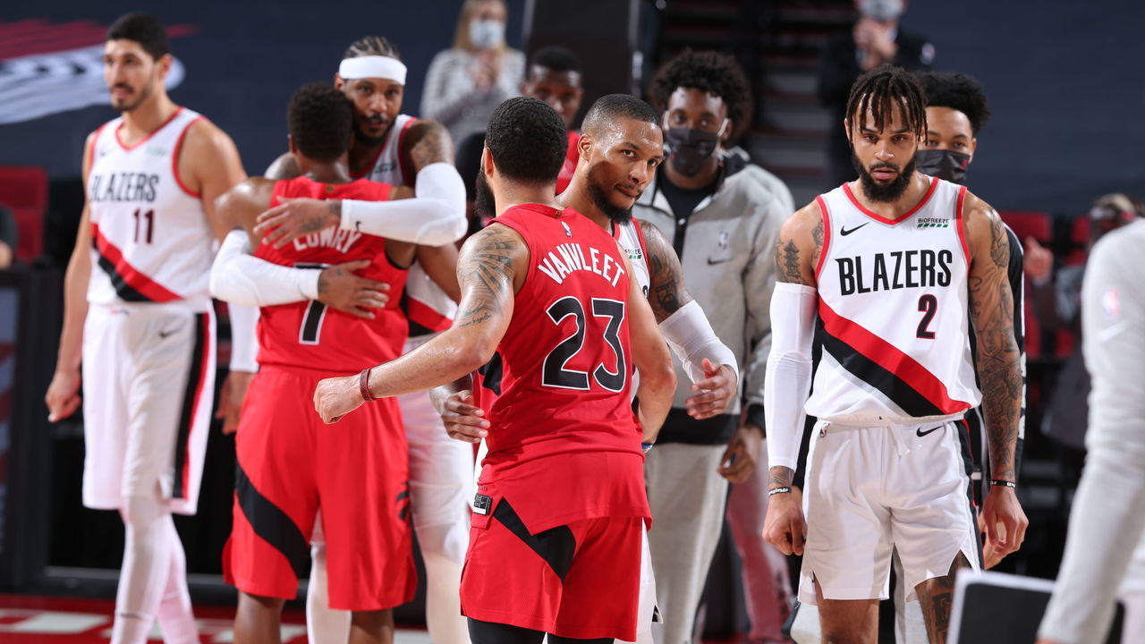 PORTLAND, OR - JANUARY 11: Damian Lillard #0 of the Portland Trail Blazers hugs Fred VanVleet #23 of the Toronto Raptors after the game on January 11, 2021 at the Moda Center Arena in Portland, Oregon. Mandatory Copyright Notice: Copyright 2021 NBAE