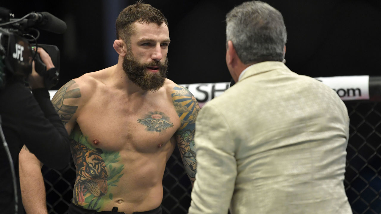 ABU DHABI, UNITED ARAB EMIRATES - JANUARY 20: (R-L) Bruce Buffer introduces Michael Chiesa prior to his fight against Neil Magny during the UFC Fight Night event at Etihad Arena on UFC Fight Island on January 20, 2021 in Abu Dhabi, United Arab Emirates.