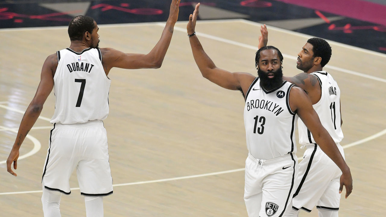 CLEVELAND, OHIO - JANUARY 20: Kevin Durant #7 James Harden #13 and Kyrie Irving #11 of the Brooklyn Nets celebrate during the first quarter against the Cleveland Cavaliers at Rocket Mortgage Fieldhouse on January 20, 2021 in Cleveland, Ohio. NOTE TO USER: User expressly acknowledges and agrees that, by downloading and/or using this photograph, user is consenting to the terms and conditions of the Getty Images License Agreement.