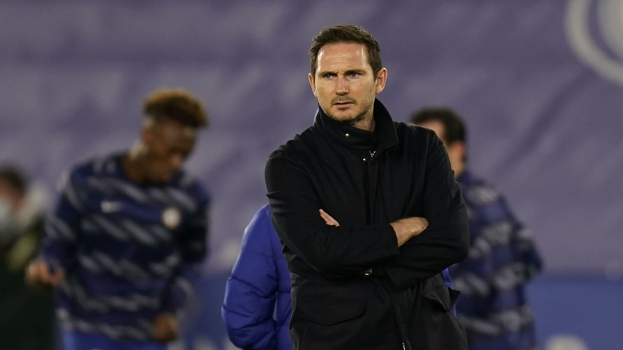 Chelsea's English head coach Frank Lampard looks on as Leicester City's players warm up during the English Premier League football match between Leicester City and Chelsea at the King Power Stadium in Leicester, central England on January 19, 2021.