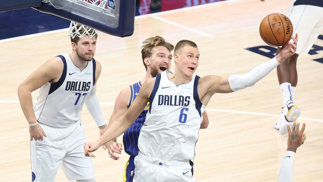 INDIANAPOLIS, INDIANA - JANUARY 20: Kristaps Porzingis #6 of the Dallas Mavericks reaches out for a rebound against the Indiana Pacers at Bankers Life Fieldhouse on January 20, 2021 in Indianapolis, Indiana.