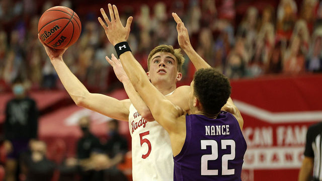 MADISON, WISCONSIN - JANUARY 20: Tyler Wahl #5 of the Wisconsin Badgers shoots over Pete Nance #22 of the Northwestern Wildcats during the second half at the Kohl Center on January 20, 2021 in Madison, Wisconsin.