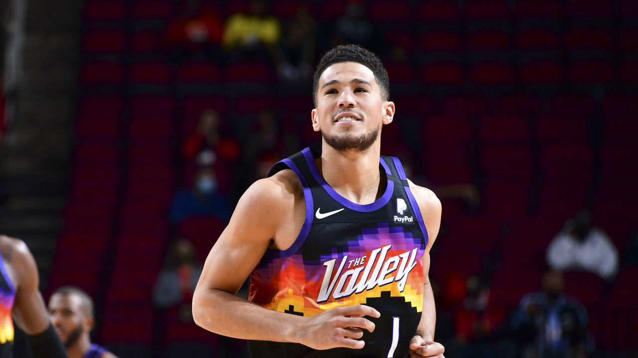 HOUSTON, TX - JANUARY 20: Devin Booker #1 of the Phoenix Suns smiles during the game against the Houston Rockets on January 20, 2021 at the Toyota Center in Houston, Texas. Mandatory Copyright Notice: Copyright 2021 NBAE