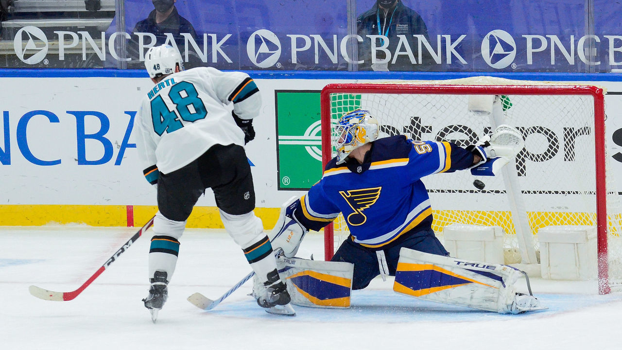 ST. LOUIS, MO - JANUARY 20: Tomas Hertl #48 of the San Jose Sharks scores the game winning goal past Jordan Binnington #50 of the St. Louis Blues in a shoot out at Enterprise Center on January 20, 2021 at Enterprise Center in St. Louis, Missouri.