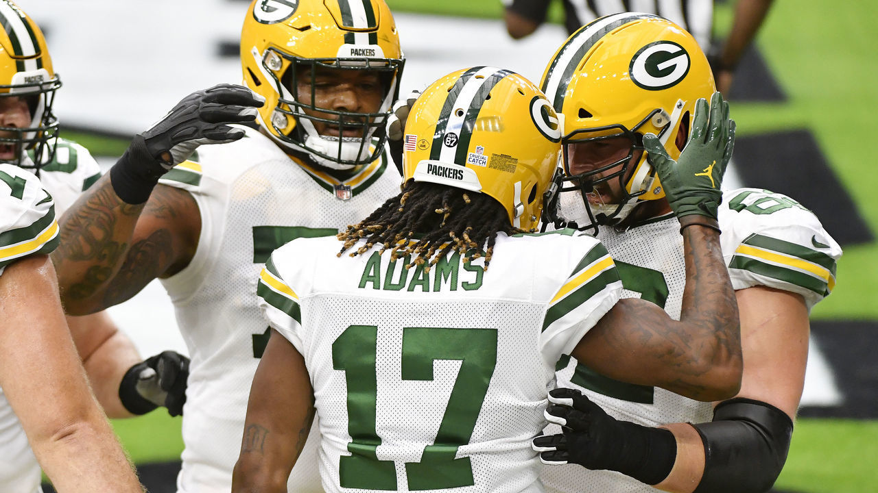 HOUSTON, TEXAS - OCTOBER 25: Davante Adams #17 of the Green Bay Packers celebrates with teammates after a 3-yard touchdown reception against the Houston Texans during the first quarter at NRG Stadium on October 25, 2020 in Houston, Texas.