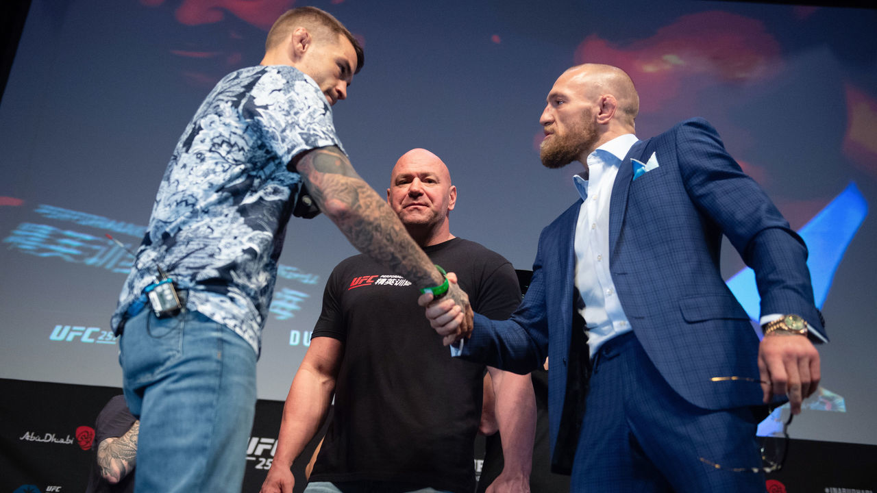 ABU DHABI, UNITED ARAB EMIRATES - JANUARY 21: (L-R) Dustin Poirier and Conor McGregor shake hands during the UFC 257 Press Conference inside Etihad Arena on UFC Fight Island on January 20, 2021 in Yas Island, Abu Dhabi, United Arab Emirates.