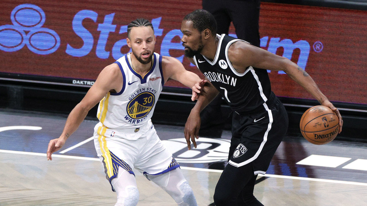 NEW YORK, NEW YORK - DECEMBER 22: Kevin Durant #7 of the Brooklyn Nets dribbles against Stephen Curry #30 of the Golden State Warriors during the first half at Barclays Center on December 22, 2020 in the Brooklyn borough of New York City. NOTE TO USER: User expressly acknowledges and agrees that, by downloading and/or using this photograph, user is consenting to the terms and conditions of the Getty Images License Agreement.