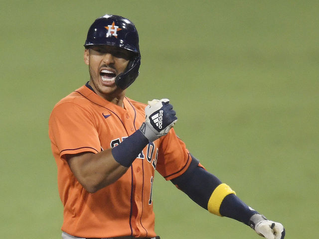 SAN DIEGO, CALIFORNIA - OCTOBER 17: Carlos Correa #1 of the Houston Astros celebrates a two run single against the Tampa Bay Rays during the eighth inning in Game Seven of the American League Championship Series at PETCO Park on October 17, 2020 in San Diego, California.