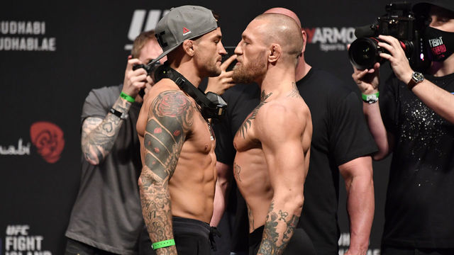 ABU DHABI, UNITED ARAB EMIRATES - JANUARY 22: (L-R) Opponents Dustin Poirier and Conor McGregor of Ireland face off during the UFC 257 weigh-in at Etihad Arena on UFC Fight Island on January 22, 2021 in Abu Dhabi, United Arab Emirates.