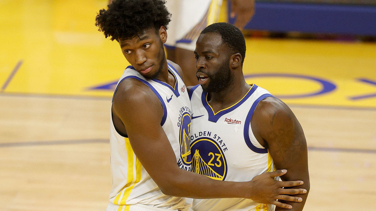 SAN FRANCISCO, CALIFORNIA - JANUARY 10: James Wiseman #33 congratulates Draymond Green #23 of the Golden State Warriors after he made a basket and was fouled during their game against the Toronto Raptors at Chase Center on January 10, 2021 in San Francisco, California.