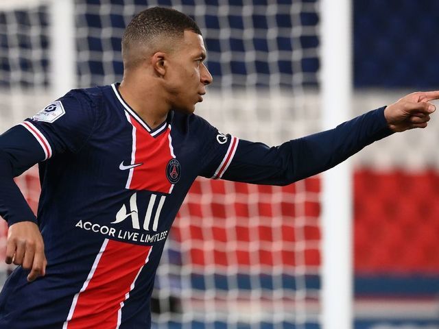 Paris Saint-Germain's French forward Kylian Mbappe celebrates after scoring a goal during the French L1 football match between Paris-Saint Germain (PSG) and Montpellier at The Parc des Princes Stadium in Paris on January 22, 2021.