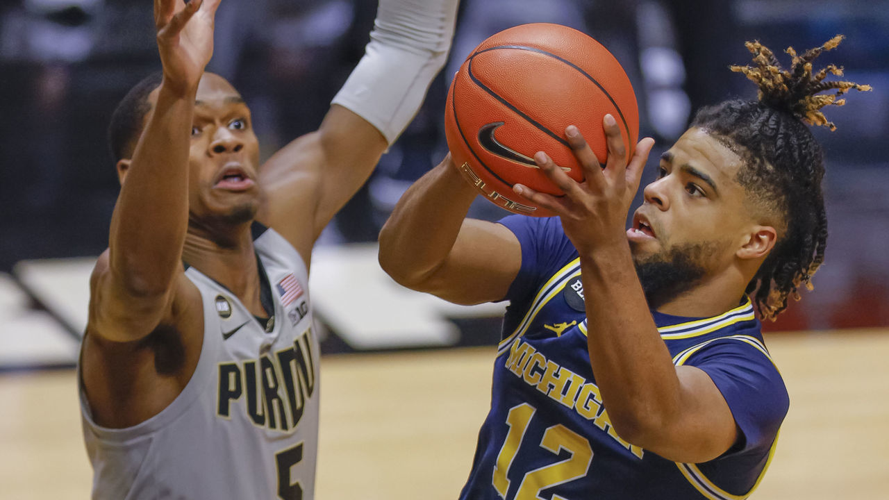 WEST LAFAYETTE, IN - JANUARY 22: Mike Smith #12 of the Michigan Wolverines shoots the ball against Brandon Newman #5 of the Purdue Boilermakers during the first half at Mackey Arena on January 22, 2021 in West Lafayette, Indiana.