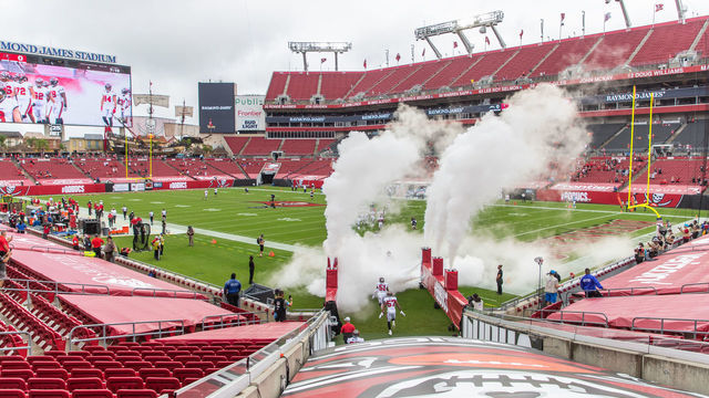 TAMPA, FLORIDA - OCTOBER 04: Quinton Bell #57 of the Tampa Bay Buccaneers and teammate Kevin Minter #51 enter the field during player introductions before the start of a game against the Los Angeles Chargers at Raymond James Stadium on October 04, 2020 in Tampa, Florida.