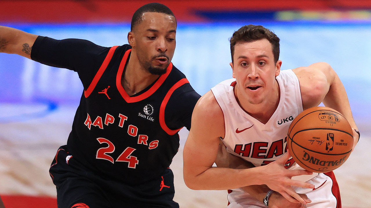 TAMPA, FLORIDA - JANUARY 22: Duncan Robinson #55 of the Miami Heat drives on Norman Powell #24 of the Toronto Raptors during a game at Amalie Arena on January 22, 2021 in Tampa, Florida.