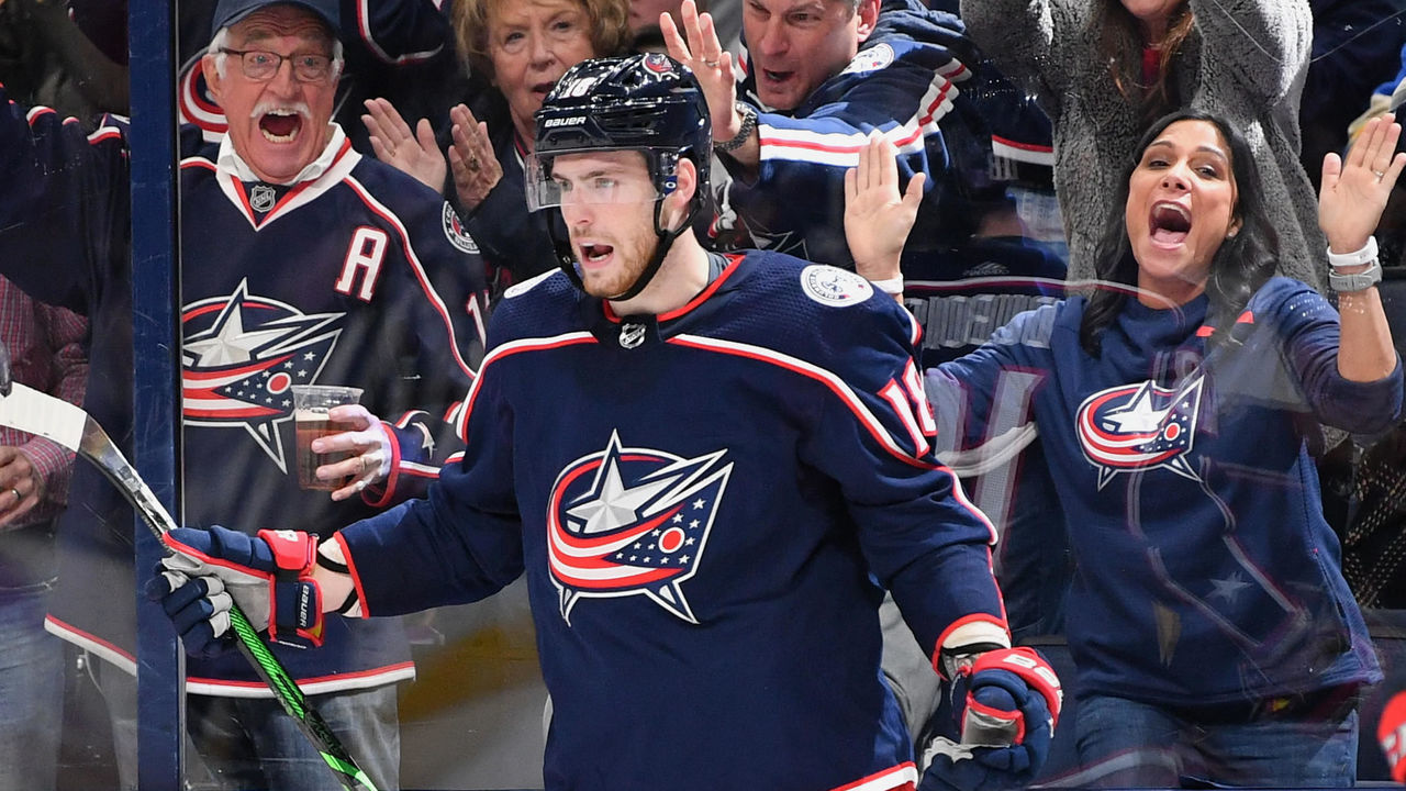 COLUMBUS, OH - NOVEMBER 15: Fans celebrate with Pierre-Luc Dubois #18 of the Columbus Blue Jackets after Dubois scored a goal against the St. Louis Blues on November 15, 2019 at Nationwide Arena in Columbus, Ohio.