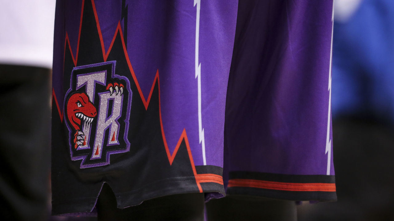 TORONTO, ON- MARCH 27 - Toronto Raptors sport their retro purple dino uniforms during the game between the Toronto Raptors and the Los Angeles Lakers at the Air Canada Centre March 27, 2015 (David Cooper/Toronto Star via Getty Images)