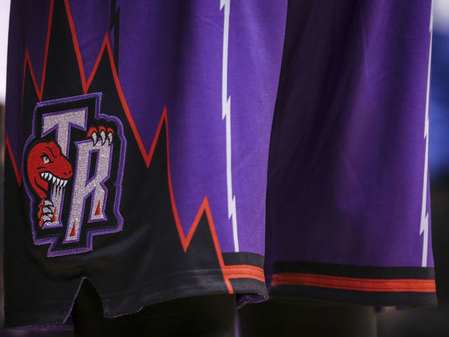 TORONTO, ON- MARCH 27 - Toronto Raptors sport their retro purple dino uniforms during the game between the Toronto Raptors and the Los Angeles Lakers at the Air Canada Centre March 27, 2015 (David Cooper/Toronto Star via Getty Images)