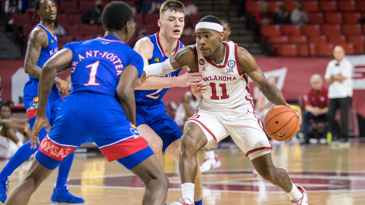 NORMAN, OK - JANUARY 23: Oklahoma Sooners guard De'Vion Harmon (11) drives to the basket during the first half against the Kansas Jayhawks at the Lloyd Noble Center in Norman Oklahoma