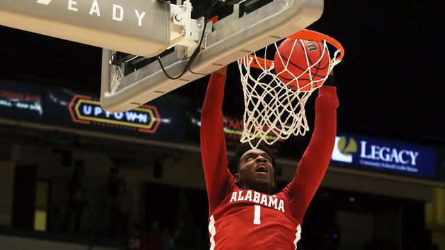 HOMEWOOD, AL - DECEMBER 18: Alabama Crimson Tide forward Herbert Jones (1) slams home the alley-oop pass in the Chick-fil-A Birmingham Classic between the Samford Bulldogs and the Alabama Crimson Tide on December 18, 2019 at Legacy Arena in Birmingham, Alabama.