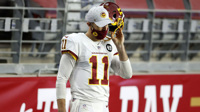 GLENDALE, ARIZONA - DECEMBER 13: Quarterback Alex Smith #11 of the Washington Football Team looks on from the sidelines during the game against the San Francisco 49ers at State Farm Stadium on December 13, 2020 in Glendale, Arizona.