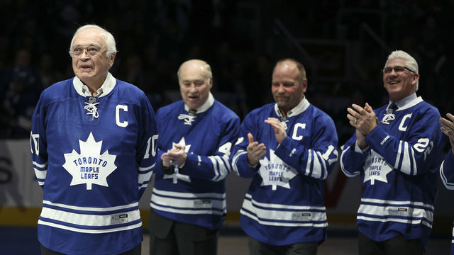 Toronto, Canada - February 21 - Armstrong (left) gets applause from Leafs Alumni Red Kelly, Wendell Clark and Rick Vaive. Prior to the Start of the game, the Leafs announced the induction of George Armstrong and Syl Apps to their Legends Row with an on ice ceremony. Syl Apps junior was on hand (left) with George Armstrong for a ceremonial puck drop. The Toronto Maple Leafs took on the Winnipeg Jets at the Air Canada Centre in Toronto. February 21, 2015 (Richard Lautens/Toronto Star via Getty Images)
