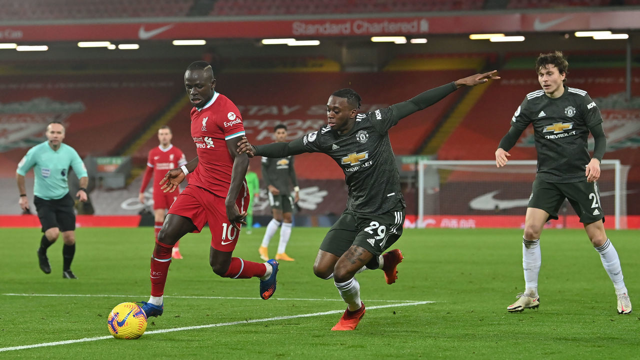 Liverpool's Sadio Mane (left) and Manchester United's Aaron Wan-Bissaka battle for the ball during the Premier League match at Anfield, Liverpool.