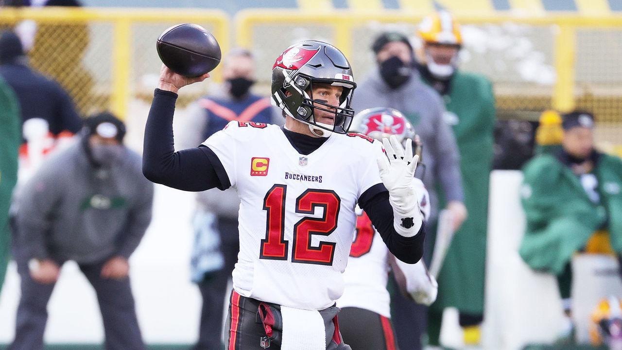 GREEN BAY, WISCONSIN - JANUARY 24: Tom Brady #12 of the Tampa Bay Buccaneers looks to pass in the first quarter against the Green Bay Packers during the NFC Championship game at Lambeau Field on January 24, 2021 in Green Bay, Wisconsin.