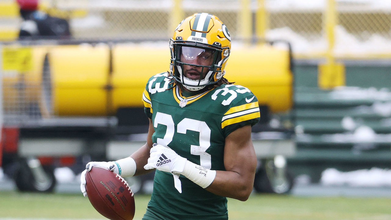 GREEN BAY, WISCONSIN - JANUARY 24: Aaron Jones #33 of the Green Bay Packers warms up prior to their NFC Championship game against the Tampa Bay Buccaneers at Lambeau Field on January 24, 2021 in Green Bay, Wisconsin.