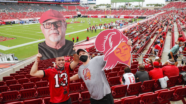 TAMPA, FLORIDA - OCTOBER 04: Fans of the Tampa Bay Buccaneers pose for a photo during the first quarter of a game between the Los Angeles Chargers and the Tampa Bay Buccaneers at Raymond James Stadium on October 04, 2020 in Tampa, Florida.