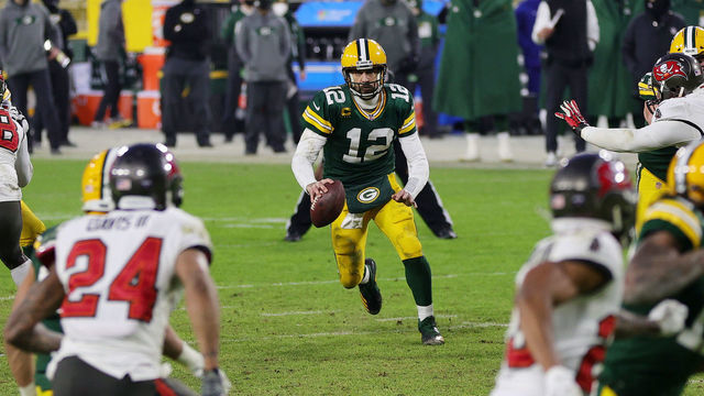 GREEN BAY, WISCONSIN - JANUARY 24: Aaron Rodgers #12 of the Green Bay Packers looks to pass in the fourth quarter against the Tampa Bay Buccaneers during the NFC Championship game at Lambeau Field on January 24, 2021 in Green Bay, Wisconsin.