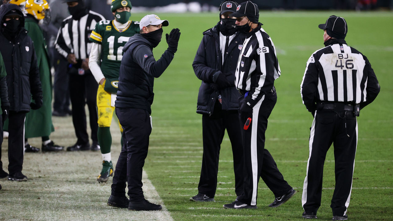 GREEN BAY, WISCONSIN - JANUARY 24: Head coach Matt LaFleur of the Green Bay Packers speaks to the referees during a review in the fourth quarter against the Tampa Bay Buccaneers during the NFC Championship game at Lambeau Field on January 24, 2021 in Green Bay, Wisconsin.