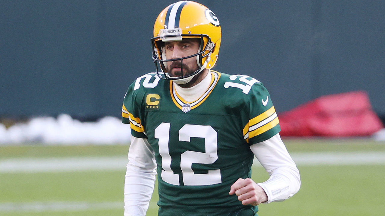 GREEN BAY, WISCONSIN - JANUARY 24: Aaron Rodgers #12 of the Green Bay Packers celebrates a touchdown in the second quarter against the Tampa Bay Buccaneers during the NFC Championship game at Lambeau Field on January 24, 2021 in Green Bay, Wisconsin.