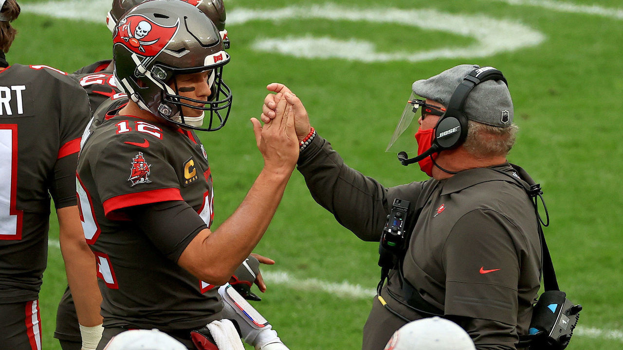 TAMPA, FLORIDA - JANUARY 03: Tom Brady #12 of the Tampa Bay Buccaneers celebrates a touchdown with head coach Bruce Arians of the Tampa Bay Buccaneers during a game against the Atlanta Falcons at Raymond James Stadium on January 03, 2021 in Tampa, Florida.
