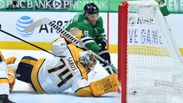 DALLAS, TX - JANUARY 24: Joe Pavelski #16 of the Dallas Stars makes certain that the puck crosses the goal line against Juuse Saros #74 of the Nashville Predators at the American Airlines Center on January 24, 2021 in Dallas, Texas.