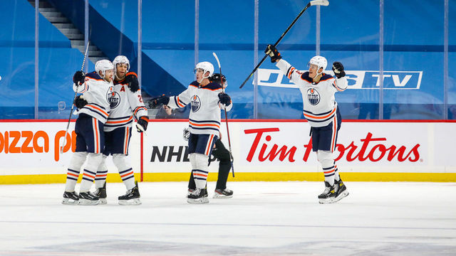 WINNIPEG, MB - JANUARY 24: Leon Draisaitl #29, Darnell Nurse #25, Ryan Nugent-Hopkins #93 and Jesse Puljujarvi #13 of the Edmonton Oilers celebrate a third period goal against the Winnipeg Jets at the Bell MTS Place on January 24, 2021 in Winnipeg, Manitoba, Canada.