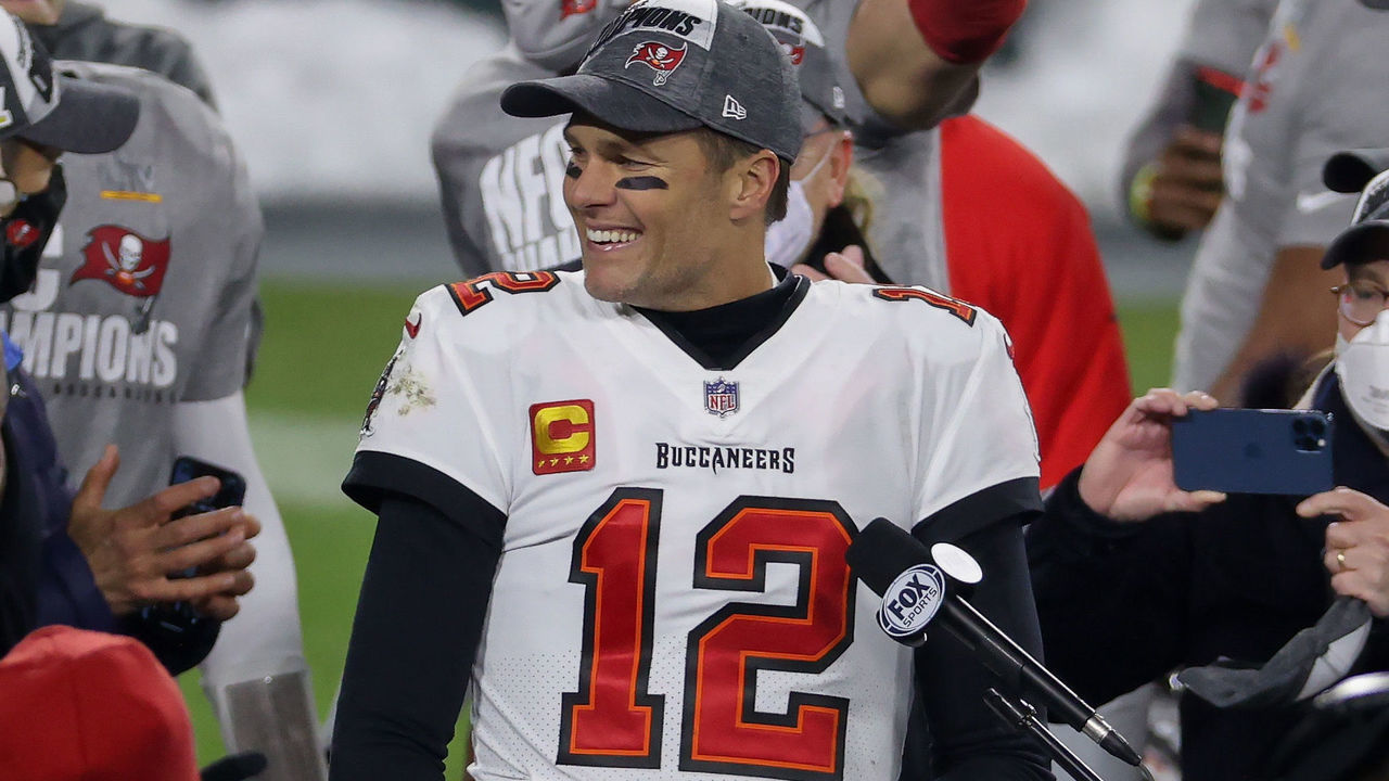 GREEN BAY, WISCONSIN - JANUARY 24: Tom Brady #12 of the Tampa Bay Buccaneers celebrates after beating the Green Bay Packers 31-26 in the NFC Championship game at Lambeau Field on January 24, 2021 in Green Bay, Wisconsin.