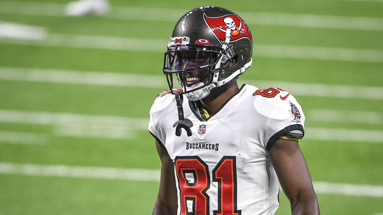 DETROIT, MICHIGAN - DECEMBER 26: Antonio Brown #81 of the Tampa Bay Buccaneers smiles while warming up before the game against the Detroit Lions at Ford Field on December 26, 2020 in Detroit, Michigan.