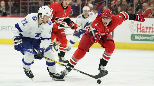 RALEIGH, NC - JANUARY 05: Carolina Hurricanes Defenceman Haydn Fleury (4) tries to chase down Tampa Bay Lightning Center Anthony Cirelli (71) during a game between the Tampa Bay Lightning and the Carolina Hurricanes on January 5, 2020 at the PNC Arena in Raleigh, NC.