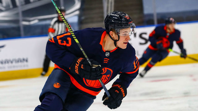 EDMONTON, AB - JANUARY 13: Edmonton Oilers Right Wing Jesse Puljujarvi (13) in his first game back skates up ice in the second period during the Edmonton Oilers game versus the Vancouver Canucks on January 13, 2021 at Rogers Place in Edmonton, AB.