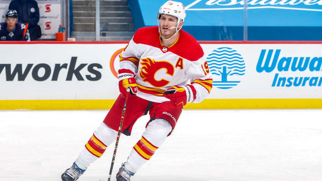 WINNIPEG, MB - JANUARY 14: Matthew Tkachuk #19 of the Calgary Flames keeps an eye on the play during second period action against the Winnipeg Jets at the Bell MTS Place on January 14, 2021 in Winnipeg, Manitoba, Canada.