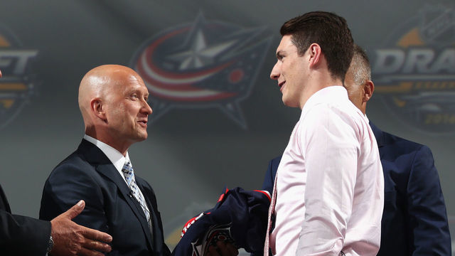BUFFALO, NY - JUNE 24: Pierre-Luc Dubois, right, shakes the hand of general manager Jarmo Kekalainen of the Columbus Blue Jackets after being selected third overall by the Columbus Blue Jackets during round one of the 2016 NHL Draft at First Niagara Center on June 24, 2016 in Buffalo, New York.