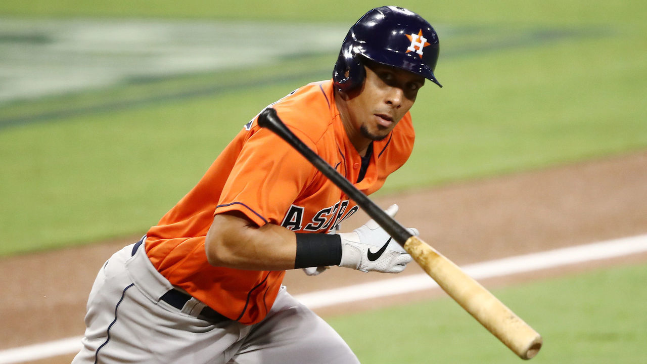 SAN DIEGO, CALIFORNIA - OCTOBER 17: Michael Brantley #23 of the Houston Astros throws his bat while looking at the Tampa Bay Rays dugout while running on a fly out during the third inning in Game Seven of the American League Championship Series at PETCO Park on October 17, 2020 in San Diego, California.
