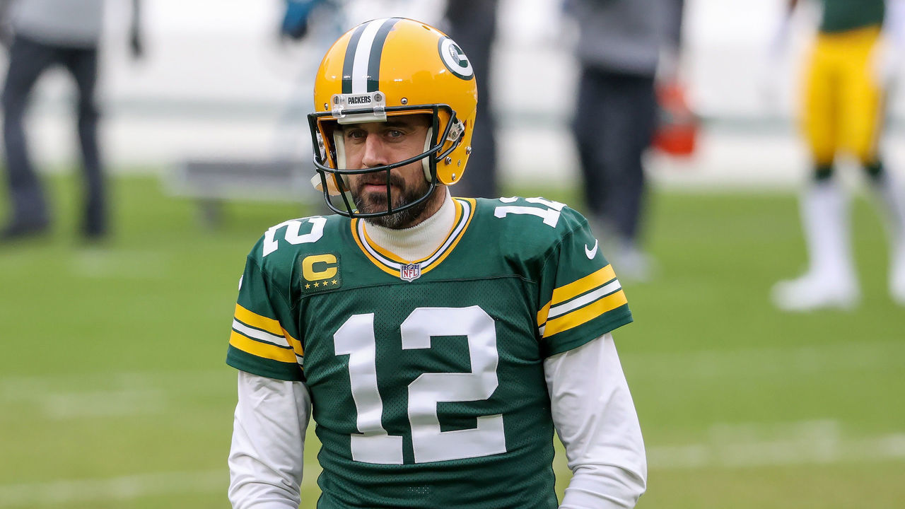 GREEN BAY, WISCONSIN - JANUARY 24: Aaron Rodgers #12 of the Green Bay Packers warms up before the NFC Championship game against the Tampa Bay Buccaneers at Lambeau Field on January 24, 2021 in Green Bay, Wisconsin.