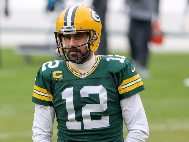 GREEN BAY, WISCONSIN - JANUARY 24: Aaron Rodgers #12 of the Green Bay Packers warms up before the NFC Championship game against the Tampa Bay Buccaneers at Lambeau Field on January 24, 2021 in Green Bay, Wisconsin.