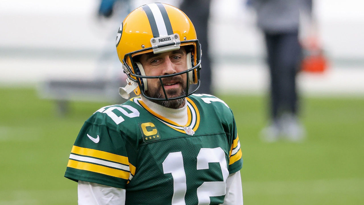 GREEN BAY, WISCONSIN - JANUARY 24: Aaron Rodgers #12 of the Green Bay Packers warms up before the NFC Championship game against the Tampa Bay Buccaneers at Lambeau Field on January 24, 2021 in Green Bay, Wisconsin.