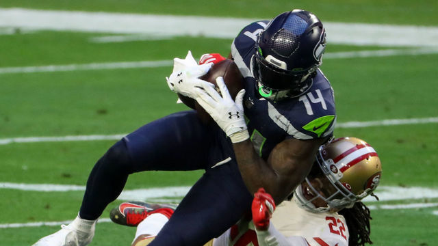 GLENDALE, AZ - JANUARY 03: Seattle Seahawks Wide Receiver DK Metcalf (14) tackles by San Francisco 49ers Cornerback Jason Verrett (22) during the NFL game at State Farm Stadium on January 3, 2021 in Glendale, Arizona.