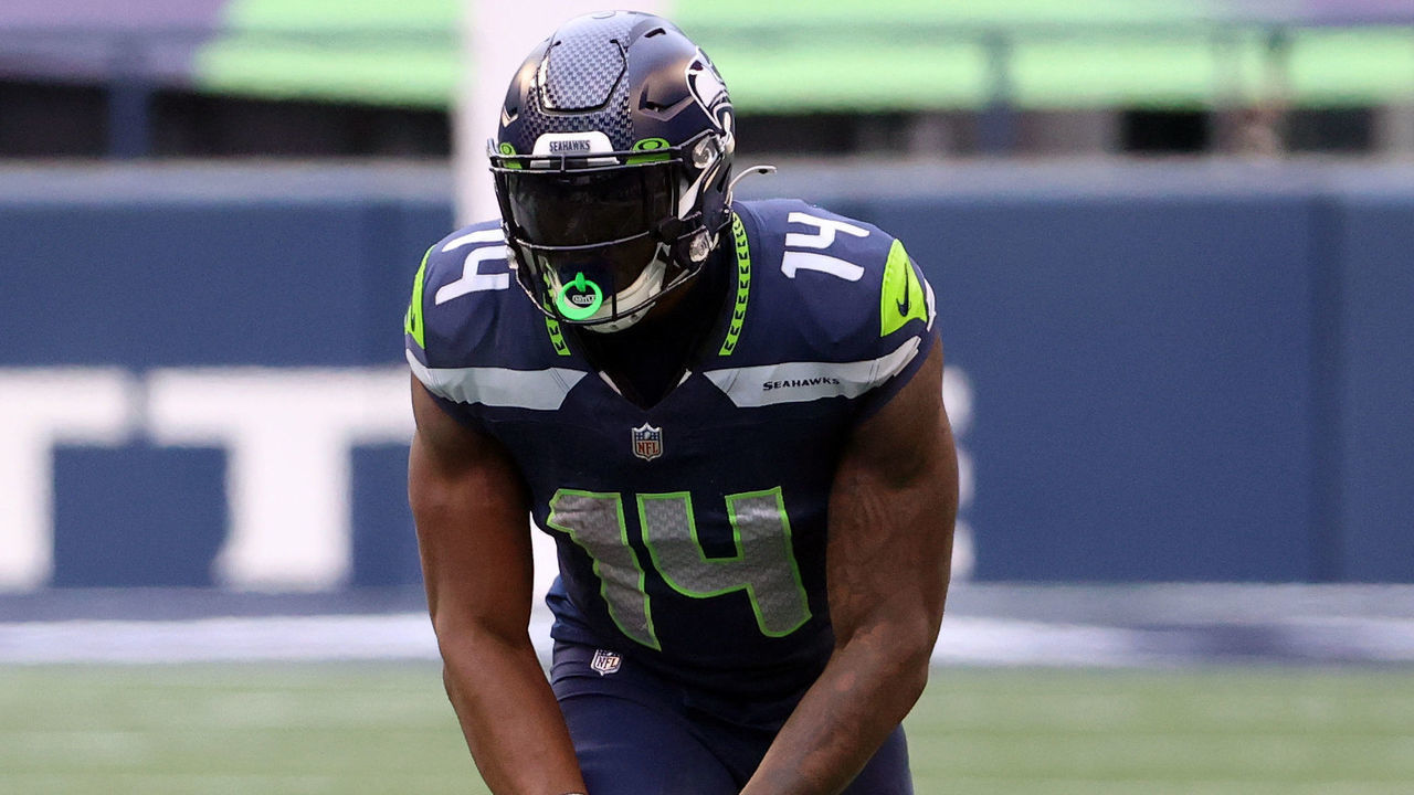 SEATTLE, WASHINGTON - JANUARY 09: DK Metcalf #14 of the Seattle Seahawks and Jalen Ramsey #20 of the Los Angeles Rams line up for play in the second quarter during the NFC Wild Card Playoff game at Lumen Field on January 09, 2021 in Seattle, Washington.